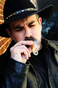 Bearded man smoking cigar