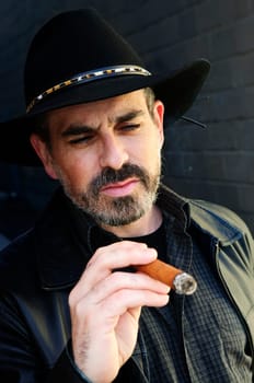 Bearded man smoking cigar