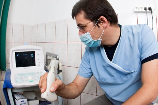 Doctor looking at modern ultrasound de