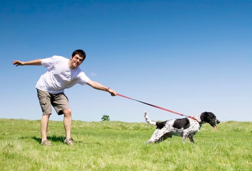 Man playing with his dog