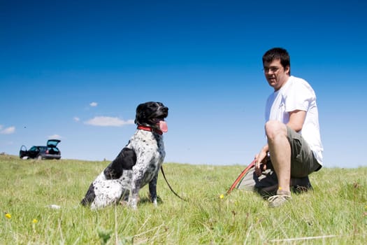 Man playing with his dog