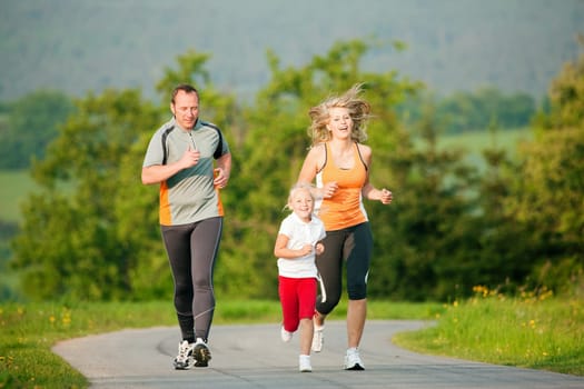 Family jogging in nature