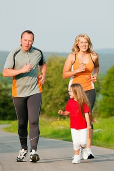 Family jogging in nature