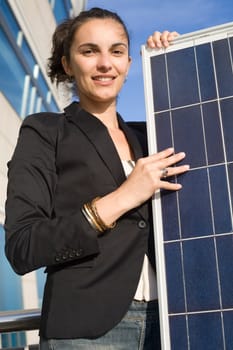 Woman holding a solar panel
