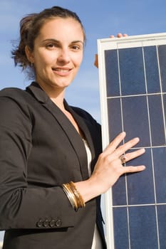 Woman holding a solar panel