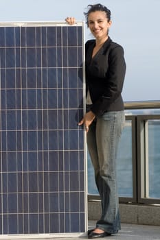 Woman holding a solar panel