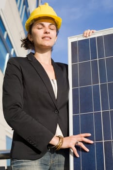 Woman holding a solar panel