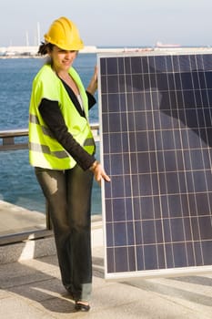 Woman holding a solar panel