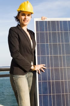Woman holding a solar panel