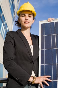Woman holding a solar panel