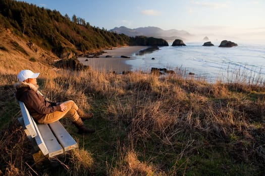 woman enjoying view at Oregon Coast
