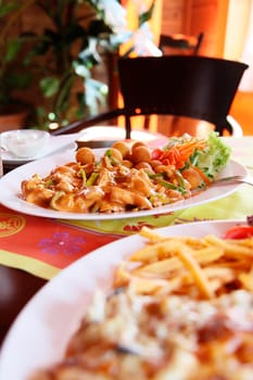 chinese food with croquettes and vegetable