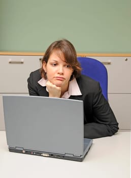 Young woman in office,unmotivated