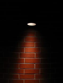 Spotlight on a red brick wall