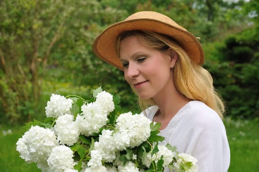 Young woman with snowballs