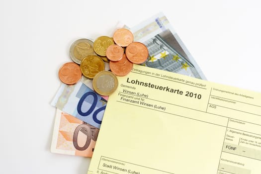 Income tax card 2010 with banknotes and euro coins