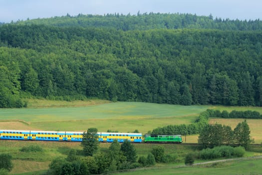 Hilly landscape with a train