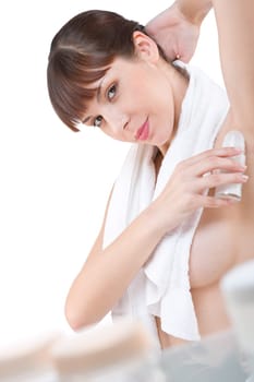 Body care - woman applying deodorant