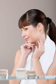 Body care Young woman in bathroom
