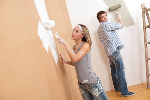 Home improvement Young couple painting