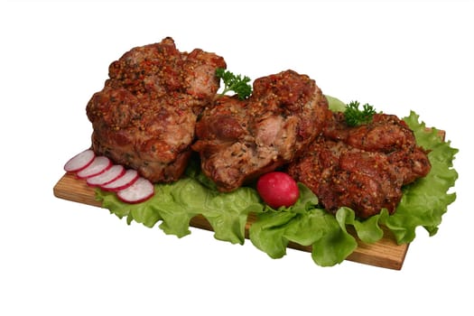 Smoked chicken kebab on wooden board.