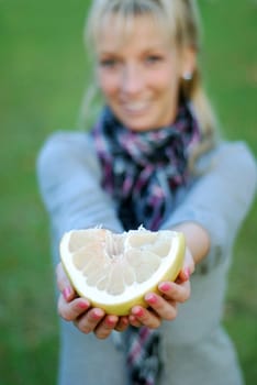 Young woman with pomelo