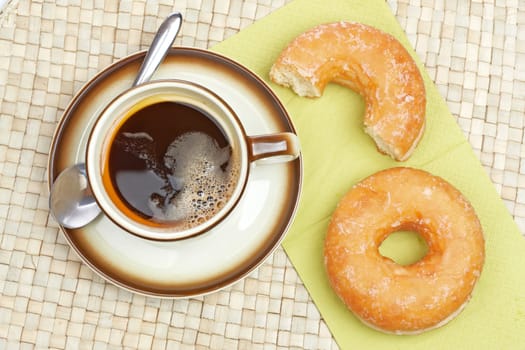 Delicious donuts with coffee