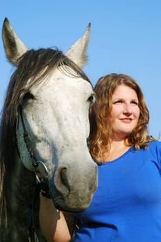 Young woman with horse