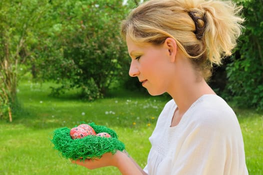 Young woman and easter eggs