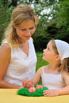 Young mother and daughter having Easter time