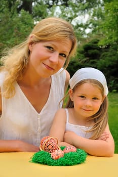 Young mother and daughter having Easter time