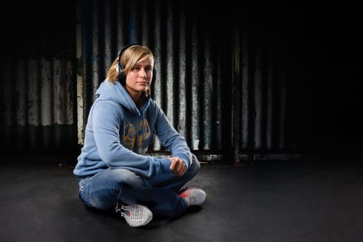 Young woman listens to music