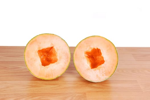 Two halve cantaloupes.