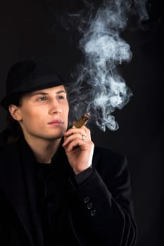 Man in black cloth think with serious look