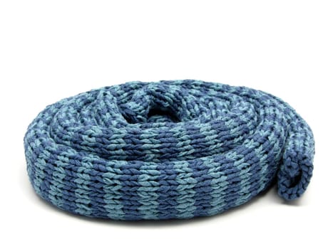 Blue striped self-knitted scarf rolled up