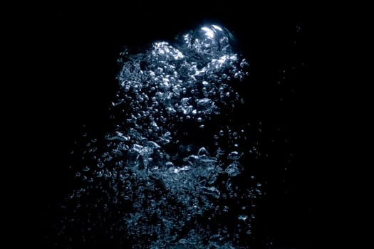 air bubbles rising over black