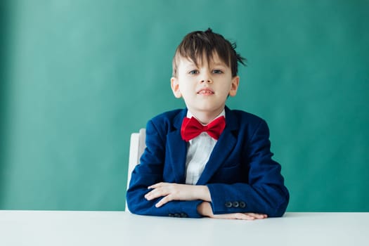 boy sitting at desk at a school education knowledge school