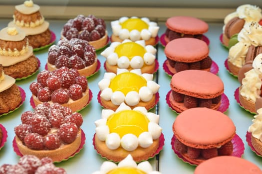 Different french cookies biscuit lemon macaroon raspberries