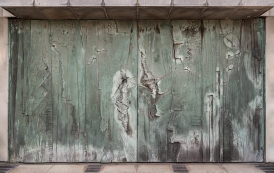 The surface of the old iron door. Abstract texture background, Old metal surface, Space for text, Selective focus.