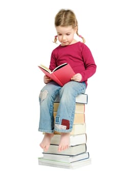 Child on a pile of books