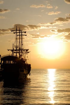 pirate ship on background sunrise