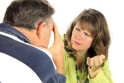 Upset and emotional middle aged couple after an argument.