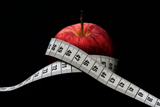 Apple with measuring tape