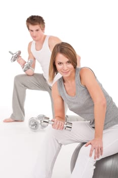 Fitness - Young couple training with weights