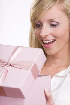 Beautiful woman opening a gift