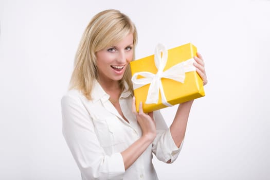 Beautiful business woman holding a gift
