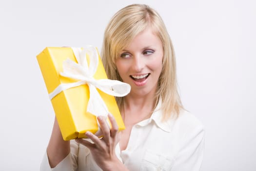 Beautiful business woman holding a gift