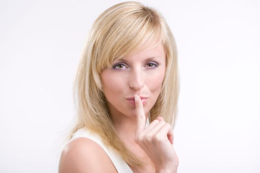 shh. secret - Young woman with her finge