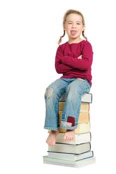 Child on a pile of books