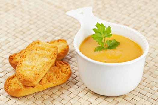 Cream of carrot soup and bread croutons